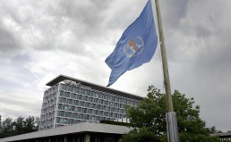 Geneva, SWITZERLAND:  The flag of the World Health Organization (WHO) flies at half mast in front of the WHO headquarters in Geneva 22 May 2006 as mark of respect for WHO Director-General Lee Jong-wook, who died earlier in the day.   AFP PHOTO / FABRICE COFFRINI  (Photo credit should read FABRICE COFFRINI/AFP/Getty Images)